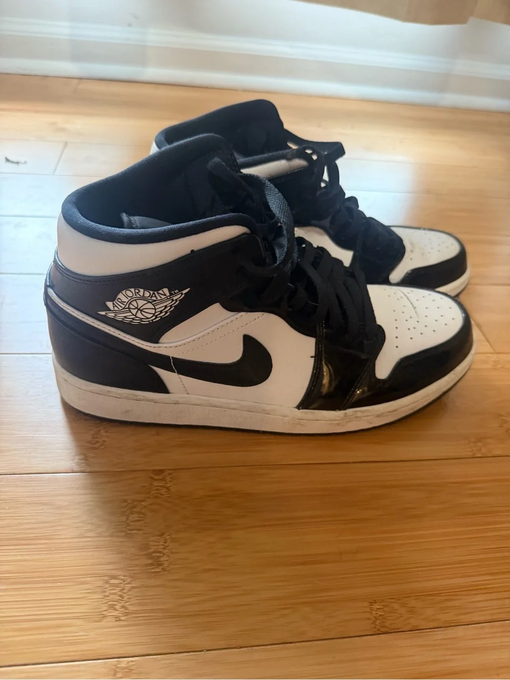 Jordan Black and White Mid-Top Sneakers